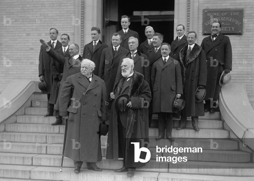 Famous inventor, Alexander Graham Bell, on the steps of the National Geographic Society to celebrate the anniversary of the Bell Telephone, 1916. Bell in in front right, next to Theodore Vail. Directly behind Bell is Thomas A. Watson