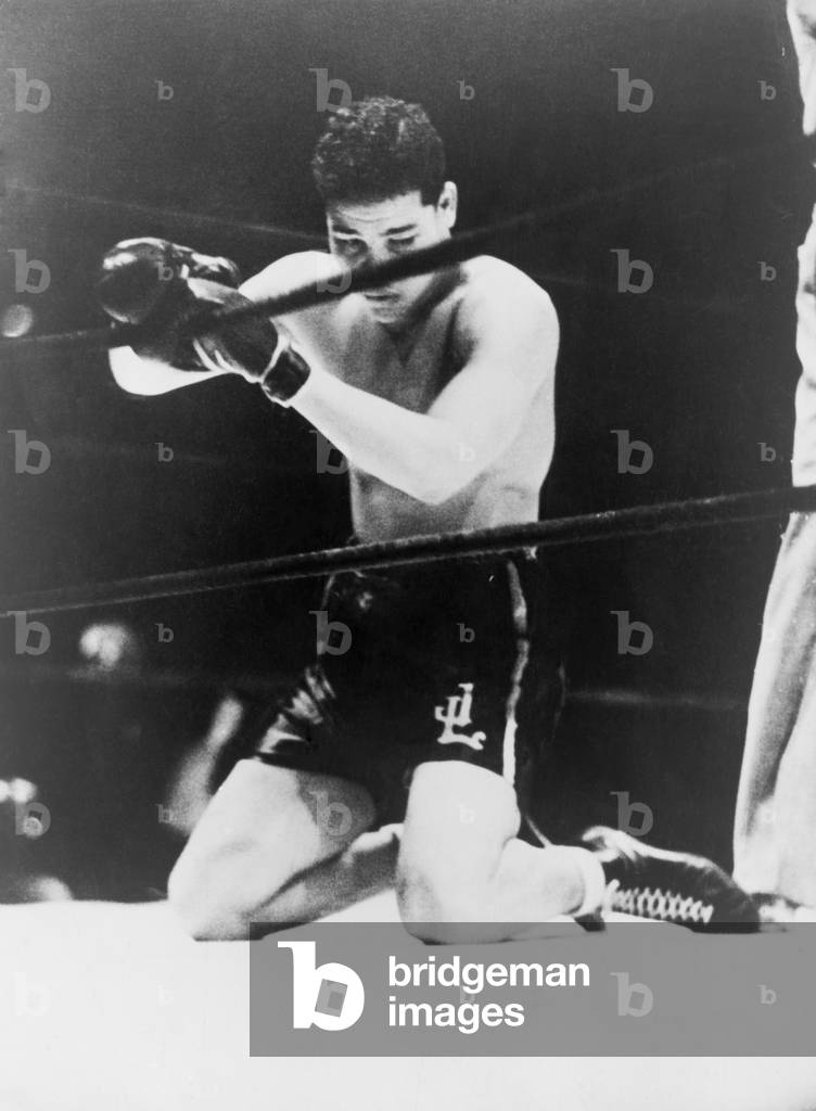 Detroit's Brown Bomber, heavyweight Joe Louis, on his knees for the final count of his fight with Max Schmeling at the Yankee Stadium, New York City. June 19, 1936
