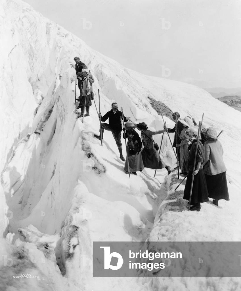 Group of men and women climbing Paradise Glacier in Mt. Rainier National Park, Washington in 1915