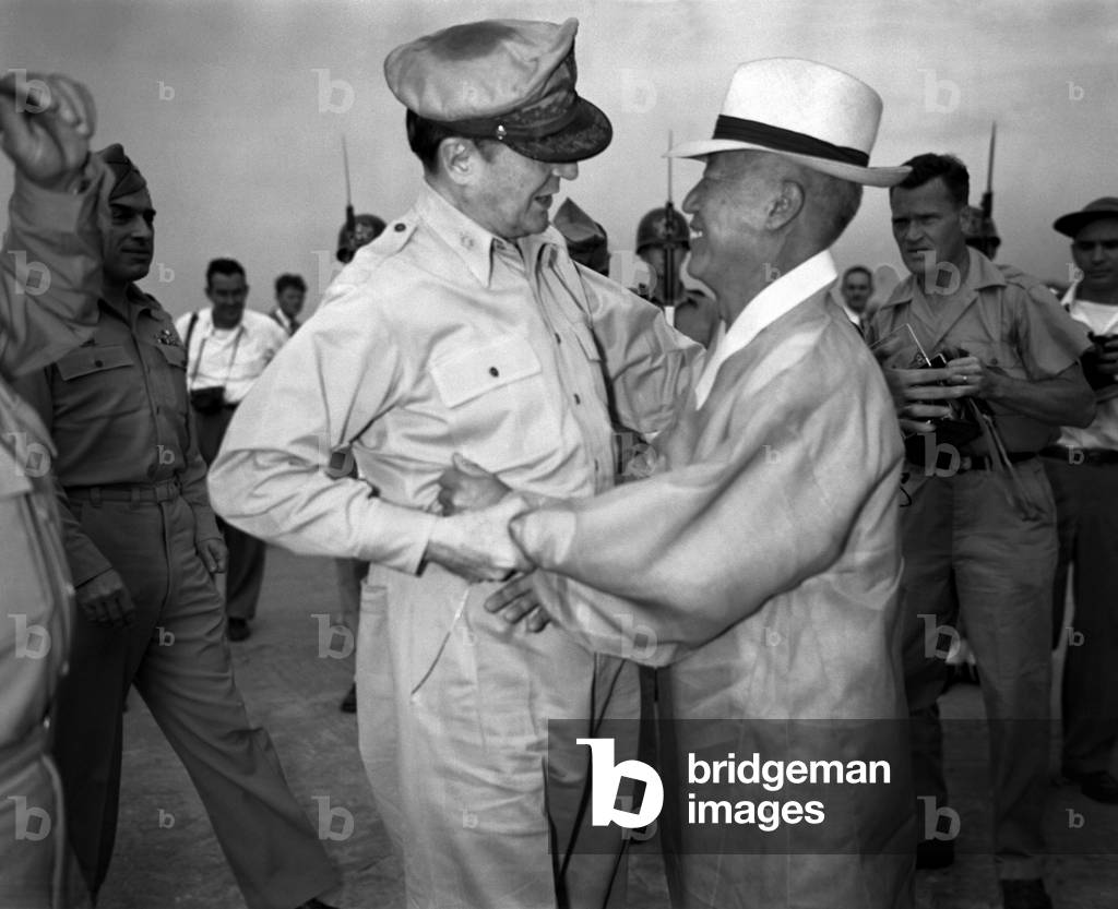 General Army Douglas MacArthur is welcomed by Dr. Syngman Rhee at Kimpo Air Force Base. MacArthur accepted Rhee's invitation to attend his Inauguration as Korea's first President on August 15, 1948