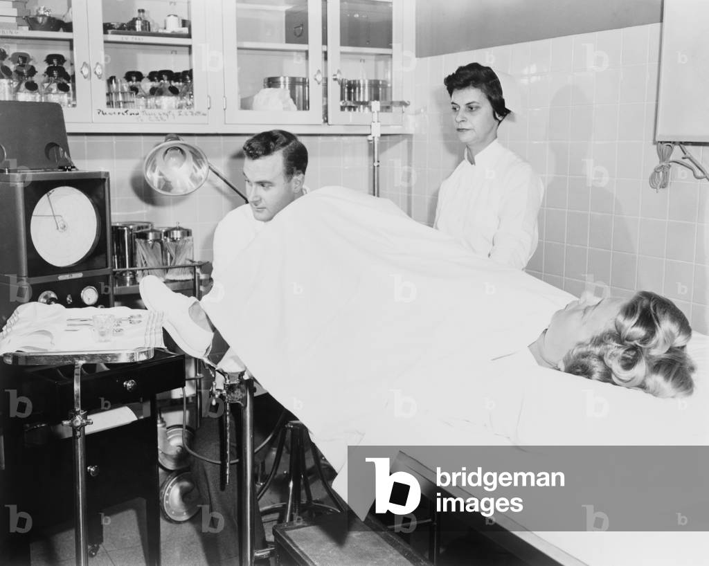 Doctor performs a Rubin test, at the infertility clinic at Long Island Jewish Hospital. The test detected fallopian tube blockages and is now replaced by laparoscopy. 1956