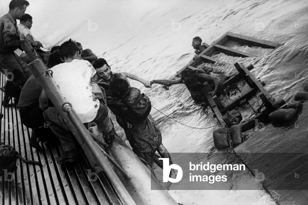 USS Sealion picks up British and Australian survivors of Japanese prison ship Rakuyo Maru. USS Sealion and other U.S. submarines torpedoed the ship three days earlier. When the USS Sealion returned it rescued only 54 of the 1159 prisoners in the Luzon Strait. World War 2, Sept. 15, 1944