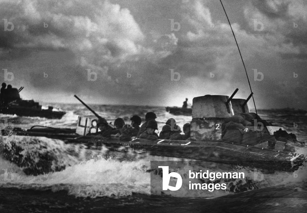 U.S. Marines ride ashore on Tinian Island in a 'Water Buffalo', July 1944. Tinian, in the Marianas Islands, was only 1,300 miles from Japan's home islands and would become a base for B-29 bombers