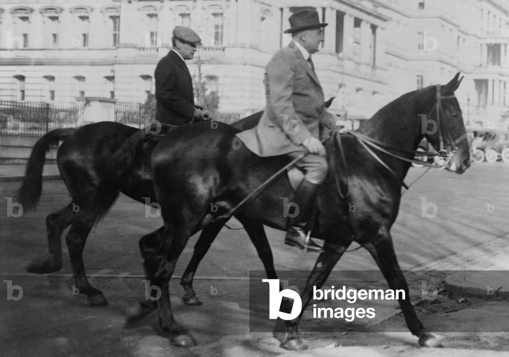 President Warren Harding and George Christian, Secretary to Harding, on horseback. They are riding on the National Mall. The role of 'Presidential Secretary' was similar to the current 'White House Chief of Staff'