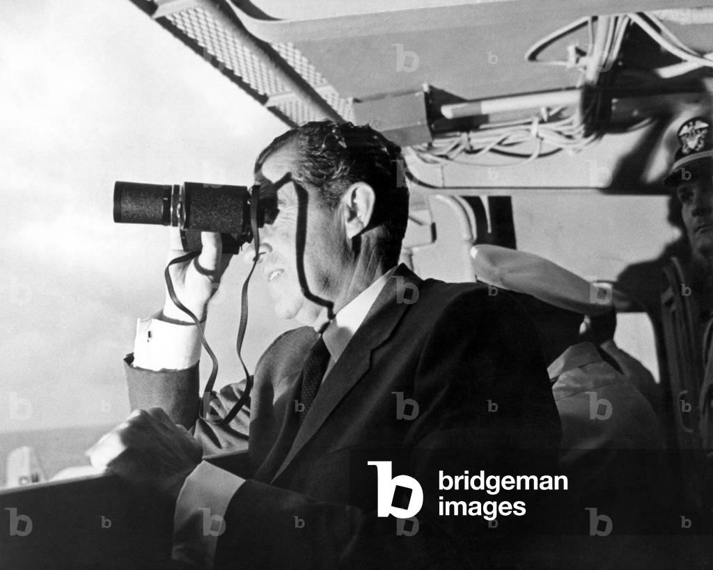 President Richard Nixon watches Apollo 11 splashdown. On the USS Hornet aircraft carrier, Nixon watches the Lunar Mission recovery. July 24, 1969