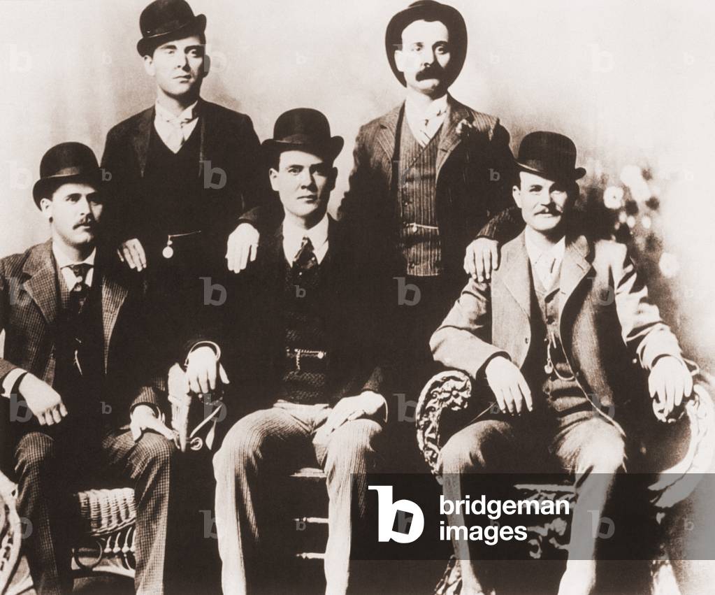 Butch Cassidy's Wild Bunch gang of train robbers in portrait taken in Fort Worth, Texas in 1901. Left to right, seated: Harry A. Longabaugh, alias the Sundance Kid, Ben Kilpatrick, alias the Tall Texan, Robert Leroy Parker, alias Butch Cassidy. Standing- Will Carver, alias News Carver and Harvey Logan, alias Kid Curry. Paul Neuman and Robert Redford starred in the 1967 film, BUTCH CASSIDY AND THE SUNDANCE KID