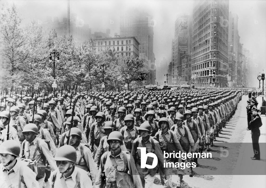 World War II, massed infantry units march up Fifth Avenue, New York City, c.June, 1942