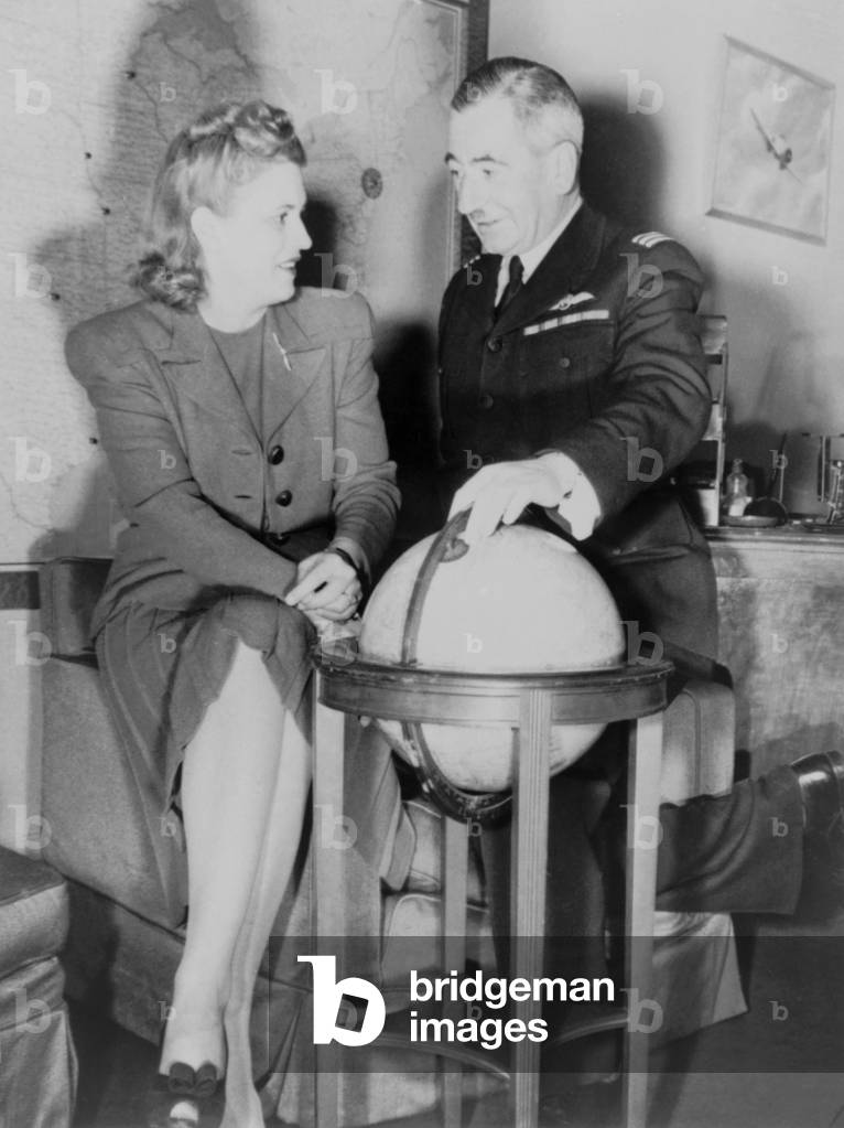 Aviator Jacqueline Cochran with Capt. Norman Edgar, from the British Transport Auxiliary Service. Cochran, an accomplished flier, was organizing licensed American woman pilots into the U.S. Women's Auxiliary Ferrying Squadron, 1942. The service was reorganized into Women Air Force Service Pilots (WASP) in 1943. World War 2