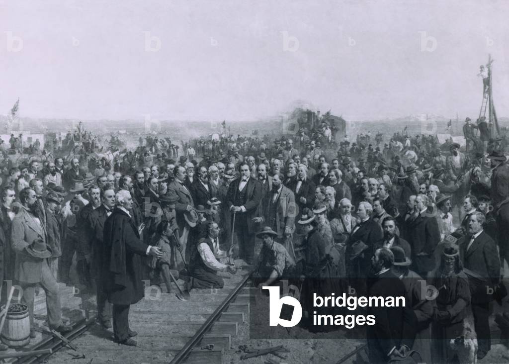THE LAST SPIKE 1881 a painting by Thomas Hill depicts the ceremony held at Promontory Point Utah on May 10 1869 marking the completion of the transcontinental railroad. Among the crowd of notables Leland Stanford in center with hammer F.L. Vandenberg kneeling with gold spike Collis Potter Huntington behind and to right of Stanford and Charles Crocker in profile holding his hat standing to the right on two women