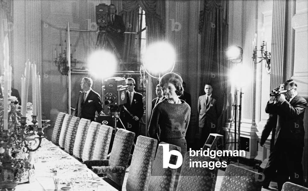 Jacqueline Kennedy and television crew in the State Dining Room of the White House, during filming of her famous TV tour of the newly refurbished executive mansion. Jan 15, 1962