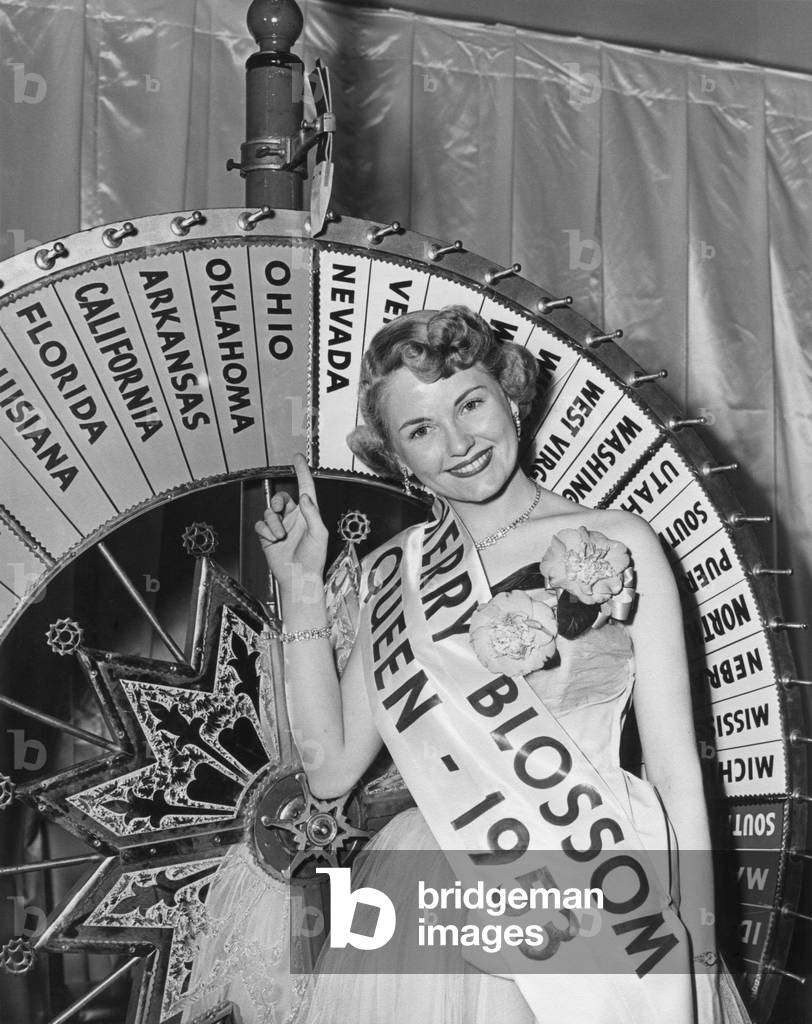The 1953 Cherry Blossom Festival Queen, April 10, 1953. First Lady Mamie Eisenhower crowned Queen Janet Bailey in 1953. She was the Cherry Blossom Festival 'Princess' selected to be 'Queen' at the Official Cherry Blossom Grand Ball.