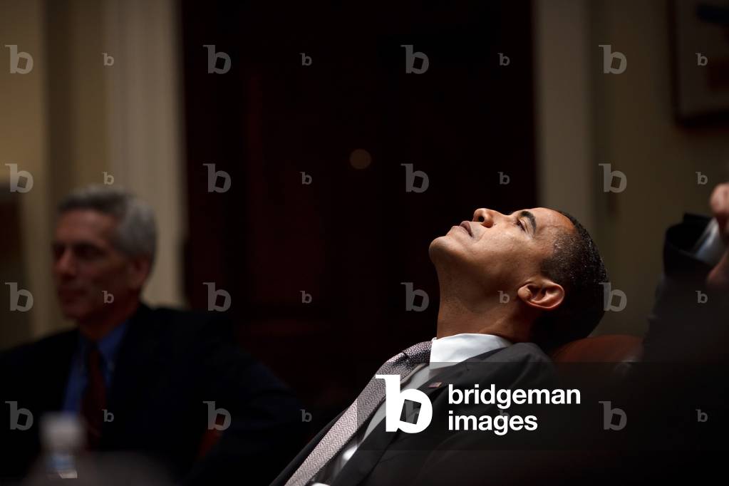 President Barack Obama looks up to the ceiling during a budget meeting in the Roosevelt Room of the White House Jan. 29 2009.,