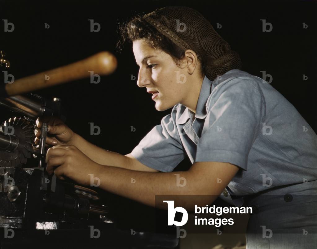 Women war worker finishing airplane parts in a hand mill at Consolidated Aircraft Corporation in Fort Worth, Texas. October 1942