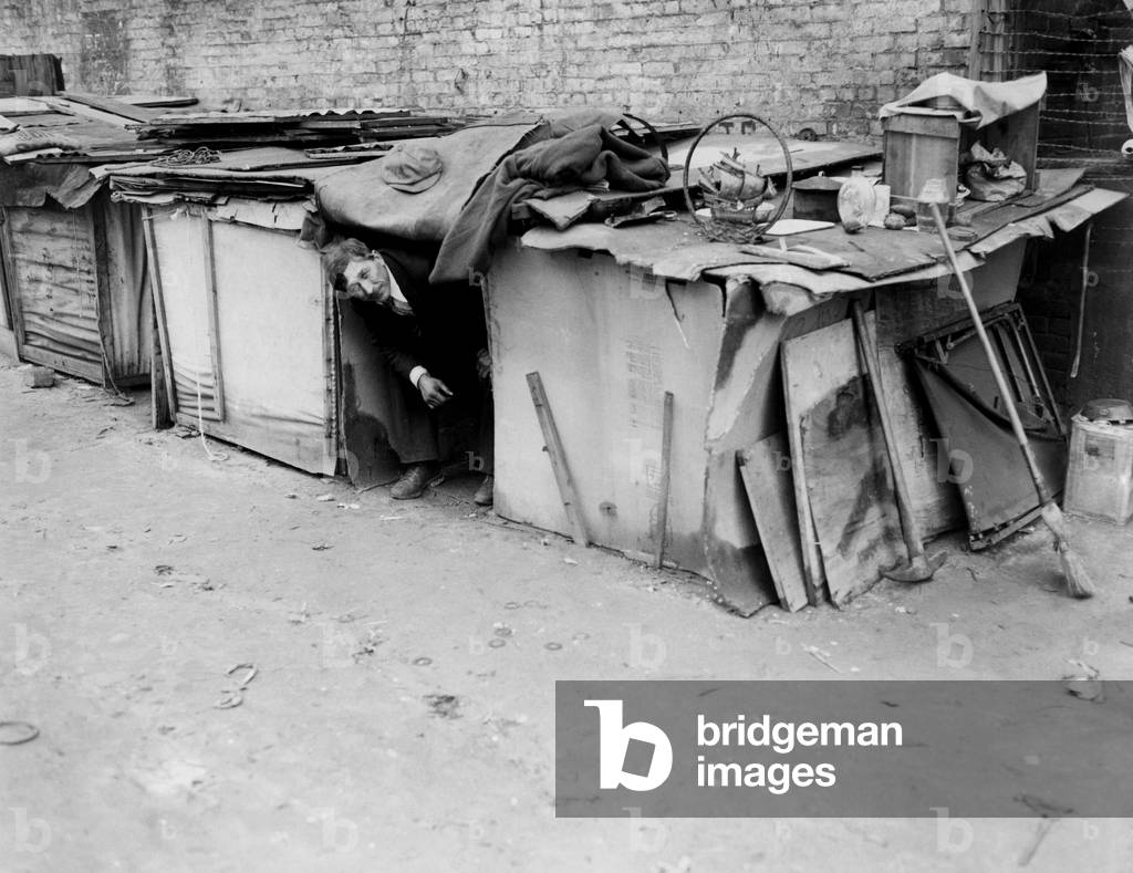 A man living in a shack off Broadway, New York, New York. February 8, 1933.