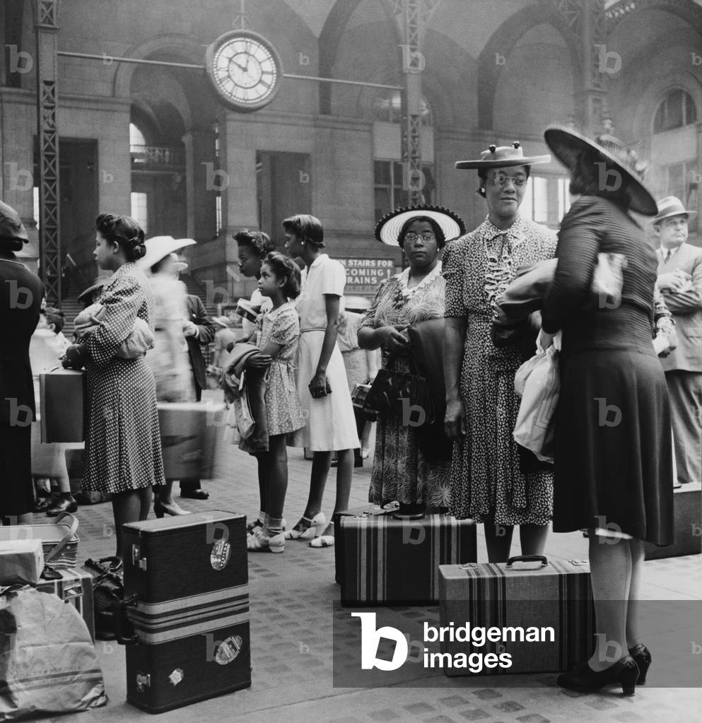Stylishly dressed African American women at New York City's Pennsylvania Station. August 1942