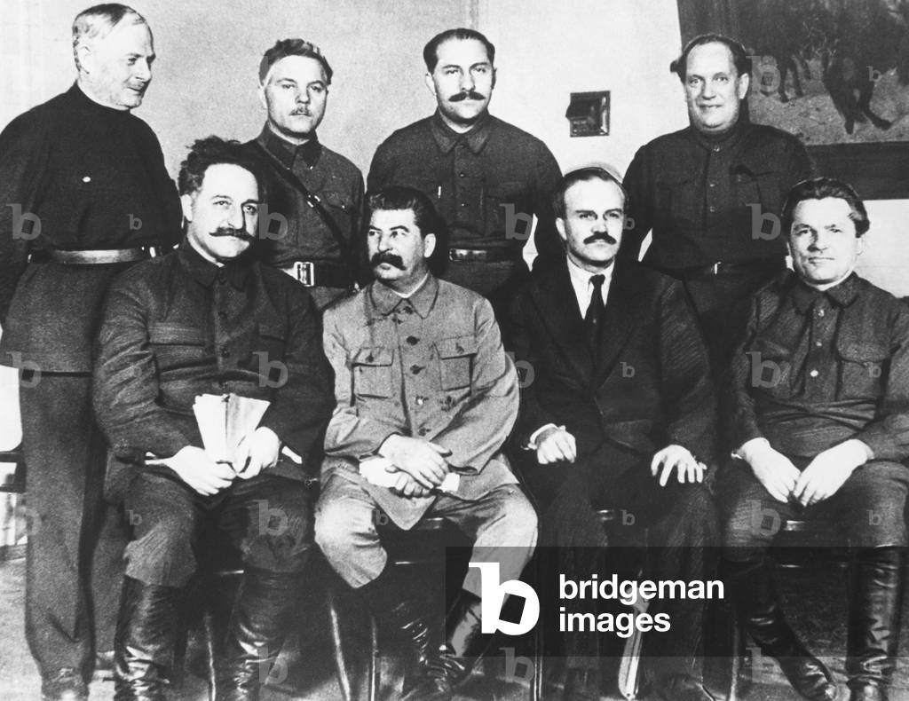 Leaders of the Russian Soviet Union, 17th Congress of the Communist Party in Moscow, 1934. Left to right, seated: G. Ordjonikidze; Stalin; V. Molotov; and S. Kirov. Left to right standing: A. Yenukidz; K. Voroshilov, L. Kaganovich, and unidentified