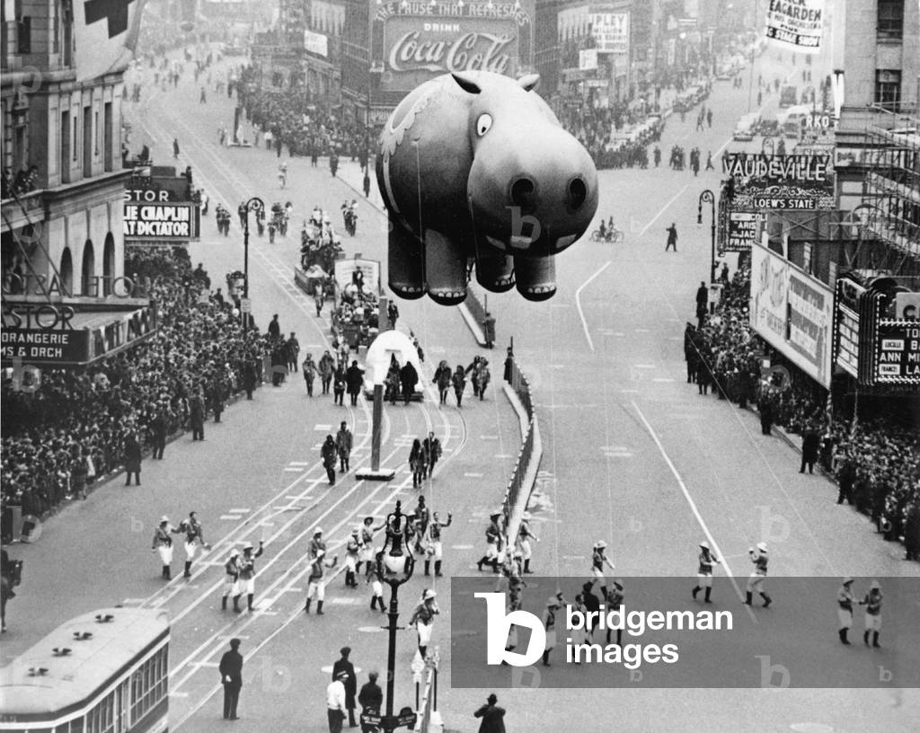 New York City, 1940. A hippo balloon floats over Times Square during the Macy's Thanksgiving Day Parade.