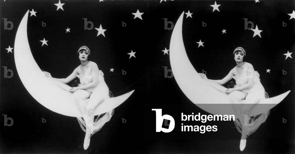 The Girl in the Moon, stereo view of a scantily clad woman sitting in a crescent moon, 1923
