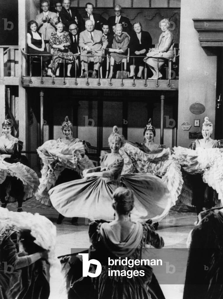 Premier Nikita Khrushchev's party watches a rehearsal for the film CANCAN. Actress Shirley MacLaine swirls surrounded by 'Cancan' dancing girls at 20th Century Fox Studios. Sept. 19, 1959