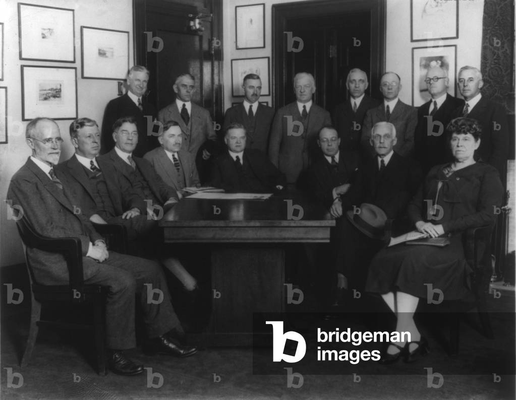 Members of President Calvin Coolidge's cabinet (Hoover, Davis, Wilbur & Mellon), American Red Cross members, and government agency representatives gathered to discuss relief work for sufferers in the Mississippi River Valley Flood. April 22, 1927