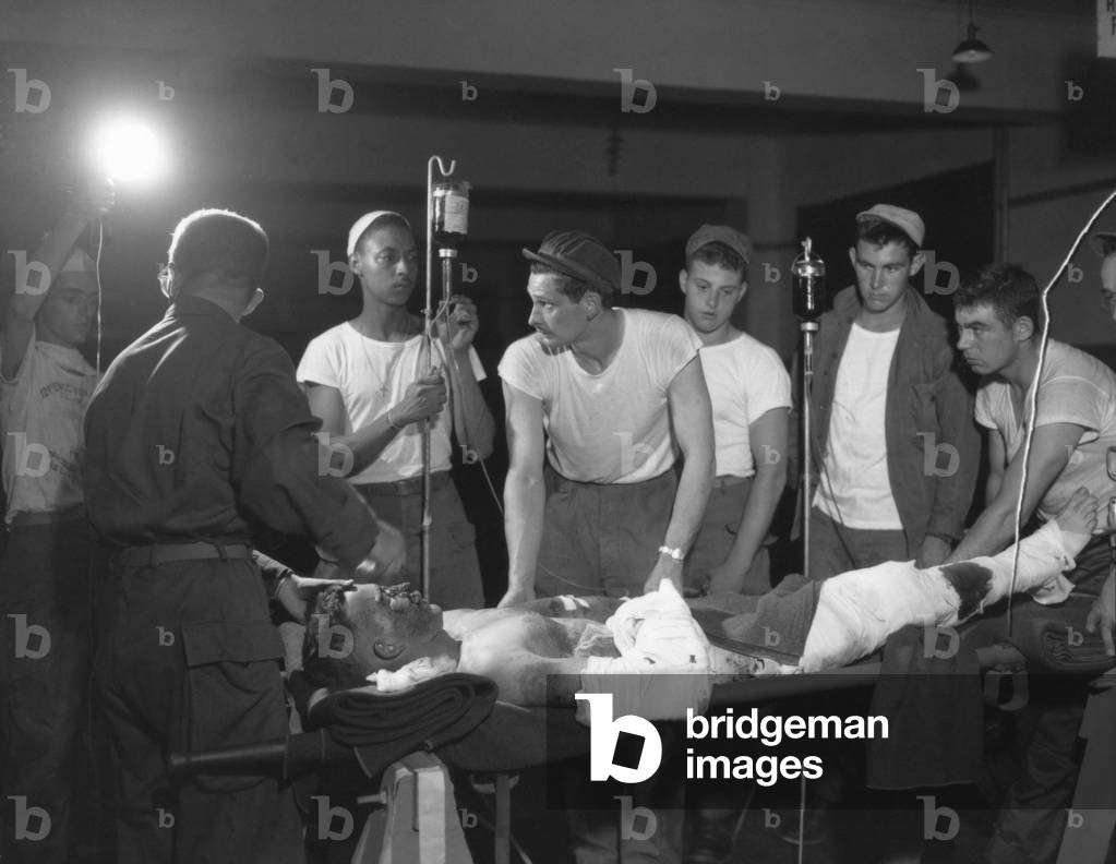 Wounded soldier prepped for surgery at the Evacuation Hospital, Korea, 1951 (photo)
