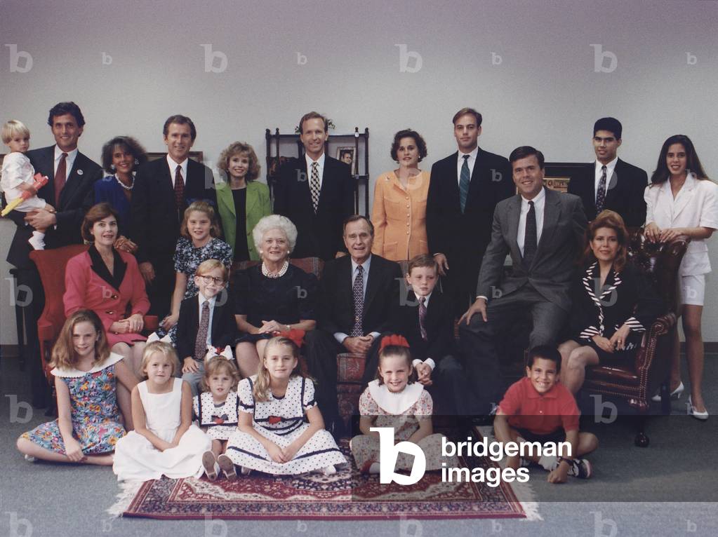 President George H. W. Bush and wife Barbara pose with their six children, their spouses and twelve grandchildren for a family portrait in Houston, Texas. c. 1991
