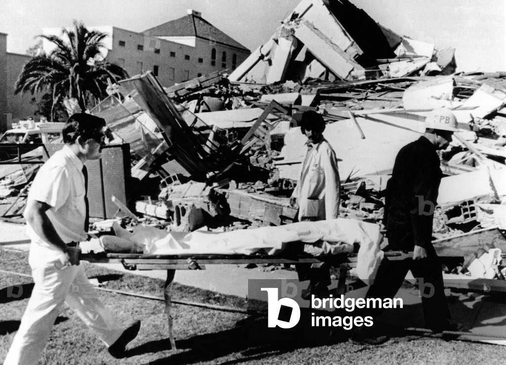 1971 San Fernando Earthquake. An injured patient from the leveled Veteran's Hospital is evacuated. At least 26 persons were killed, 11 of them at this hospital. Feb. 9, 1971