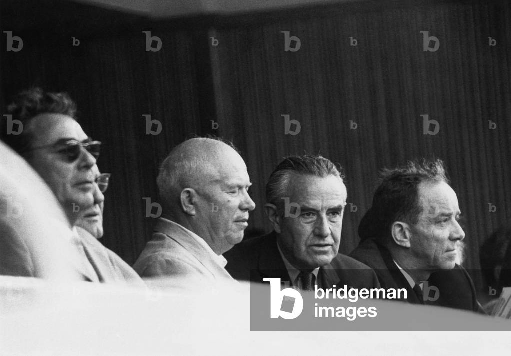 Nuclear Test Ban Treaty talks underway, July 21, 1963. Soviet Premier Nikita Khrushchev and Undersecretary of State Averill Harriman, Chief Negotiator in nuclear test ban talks, watch US-USSR fifth annual field and track meet at Lenin Stadium. Leonid Brezhnev (left) was already working with the Presidium, for Khrushchev's ouster.