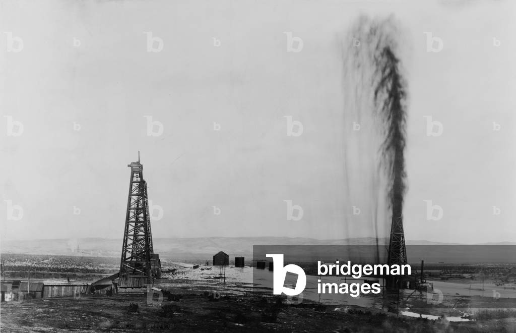 Gusher in a California oil field, c. 1910