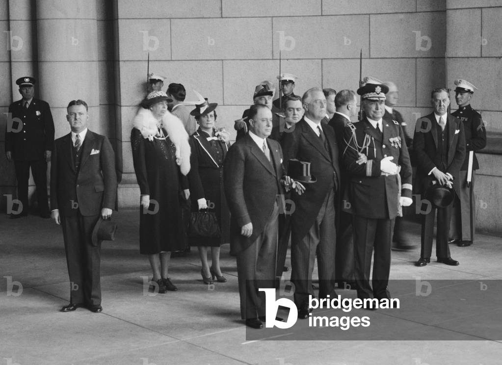 Presidents Franklin Roosevelt and Anastasio Somoza of Nicaragua. Group stands at attention during 21-gun salute in Somoza's honor, May 5, 1939. Back row: Eleanor Roosevelt, Senora de Somoza. Front Row: Anastasio Somoza, FDR, Edwin Watson (aide), Stephen Early (Press Sec)