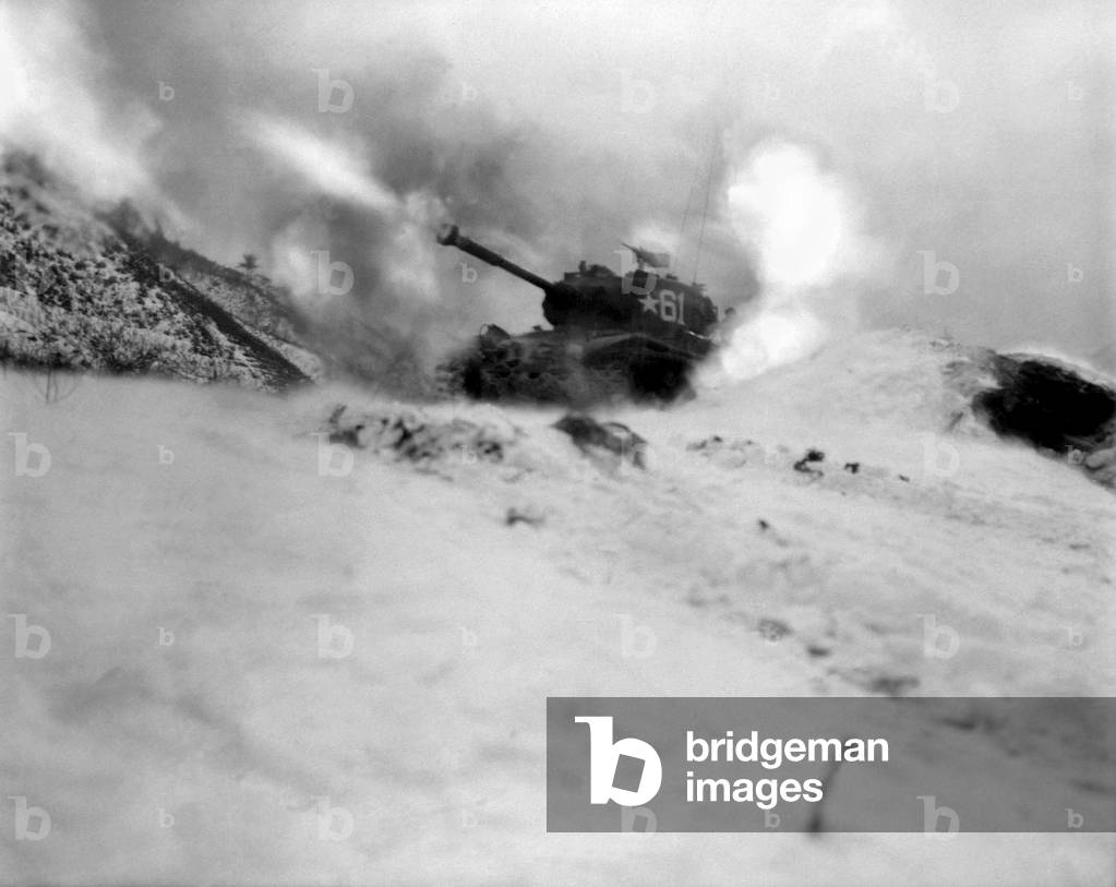 M46 tank of 6th Tank Battalion fires on enemy positions in support of the infantry near Song Sil-li, Korea. In the Korean War tank tactics were developed for the extreme rough terrain. January 10, 1952