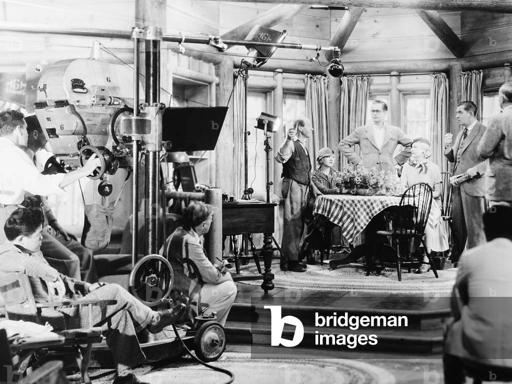 BIOGRAPHY OF A BACHELOR GIRL, cinematographer James Wong Howe (seated left), director Edward H. Griffith (seated front), at table from left: Una Merkel (seated), Robert Montgomery, Ann Harding, Edward Everett Horton on set, 1935