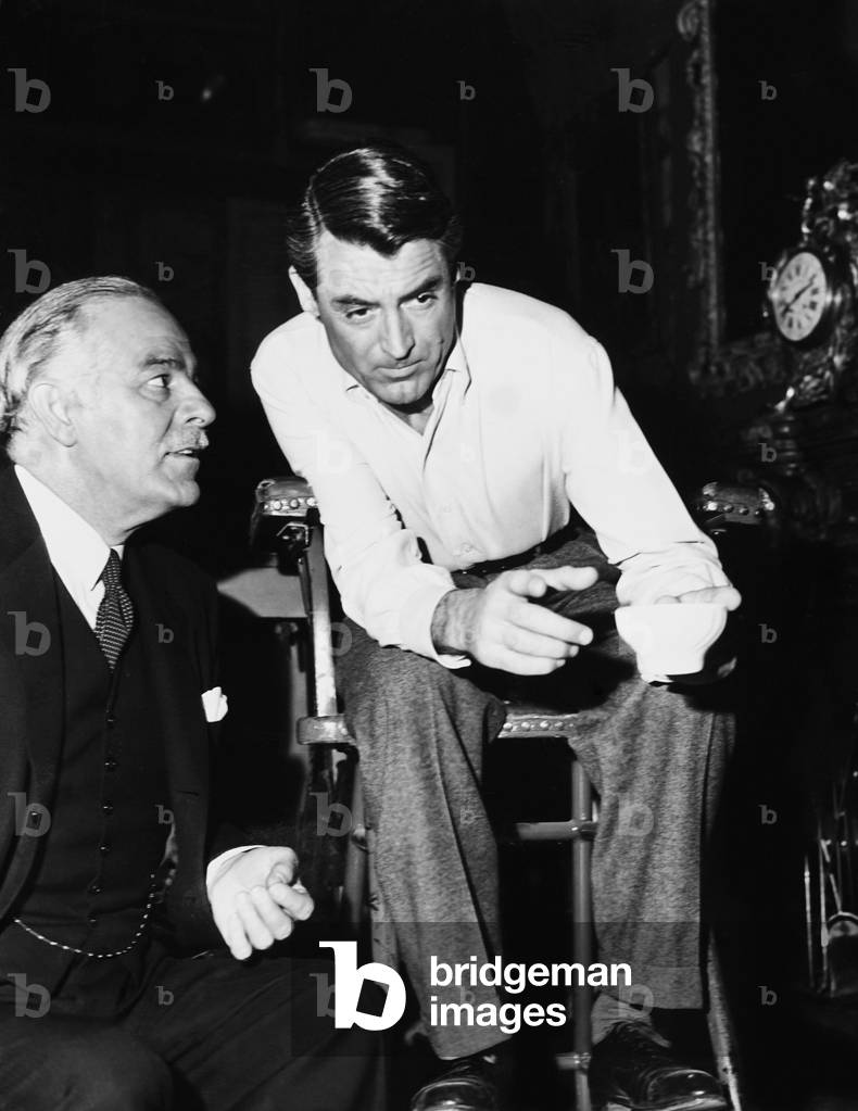 CRISIS, from left: Antonio Moreno, Cary Grant on set, 1950