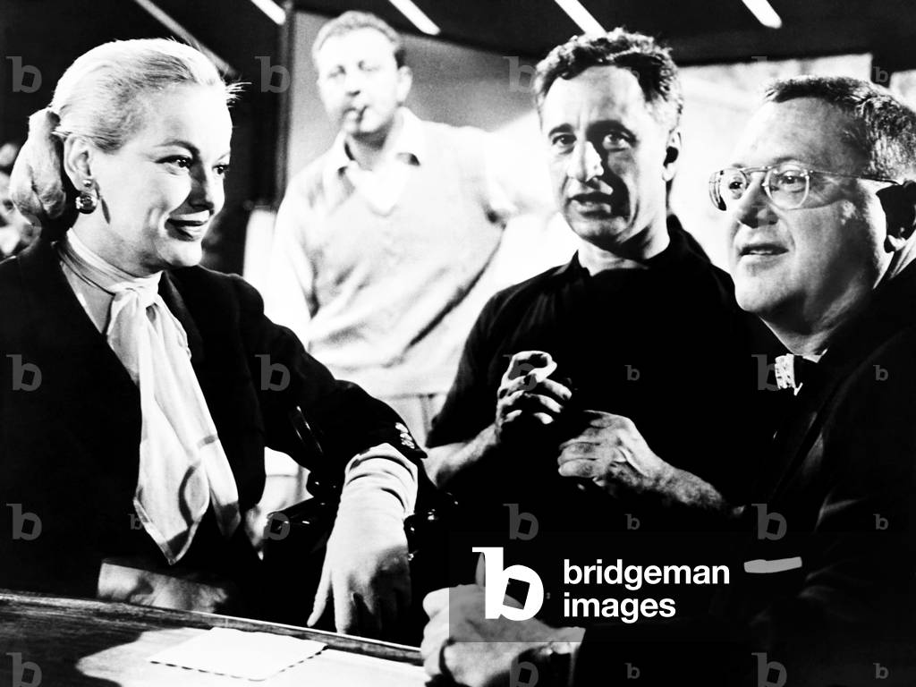 A FACE IN THE CROWD, director Elia Kazan, center, visted on-set by Faye Emerson and Sam Levinson, 1957