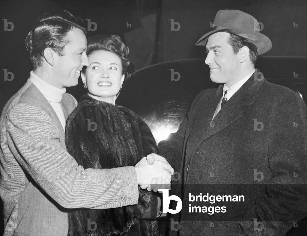 DESPERATE, from left: Steve Brodie and new wife Lois Andrews congratulated by Raymond Burr on set, 1947