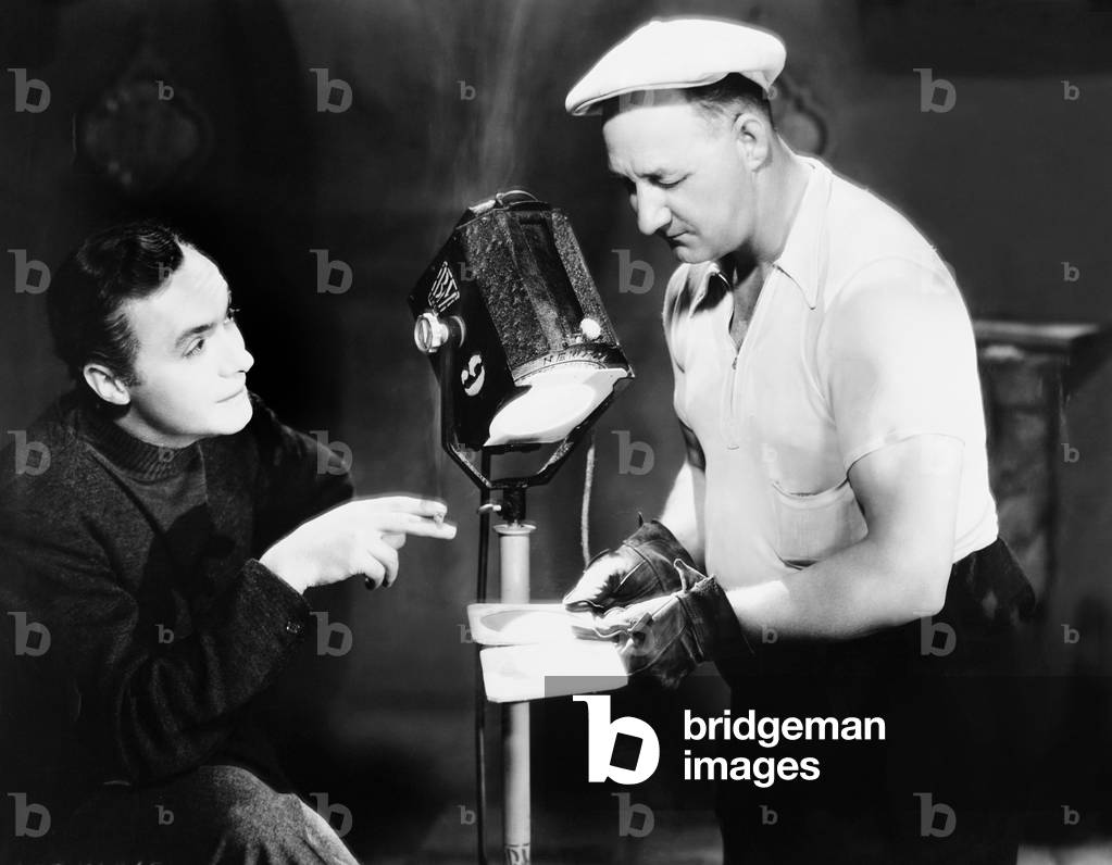 THE GARDEN OF ALLAH, from left: Charles Boyer, Ping Bodie on set, 1936