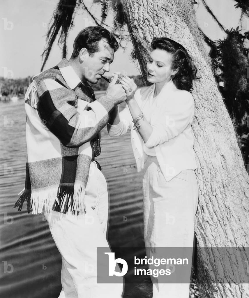 CROSSWINDS, from left: John Payne, Rhonda Fleming on location, 1951