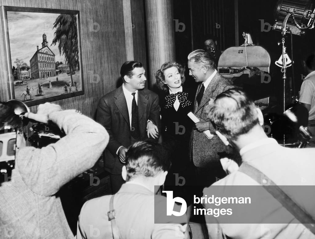 ADVENTURE, from left: Clark Gable, Greer Garson, director Victor Fleming on the first day of shooting on set, 1945
