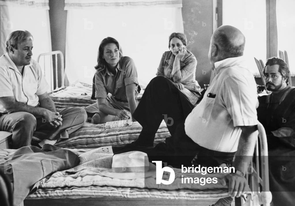 EXODUS, director Otto Preminger (back to camera) with from left: Lee J. Cobb, Alexandra Stewart, Betty Walker, John Derek on set, 1960