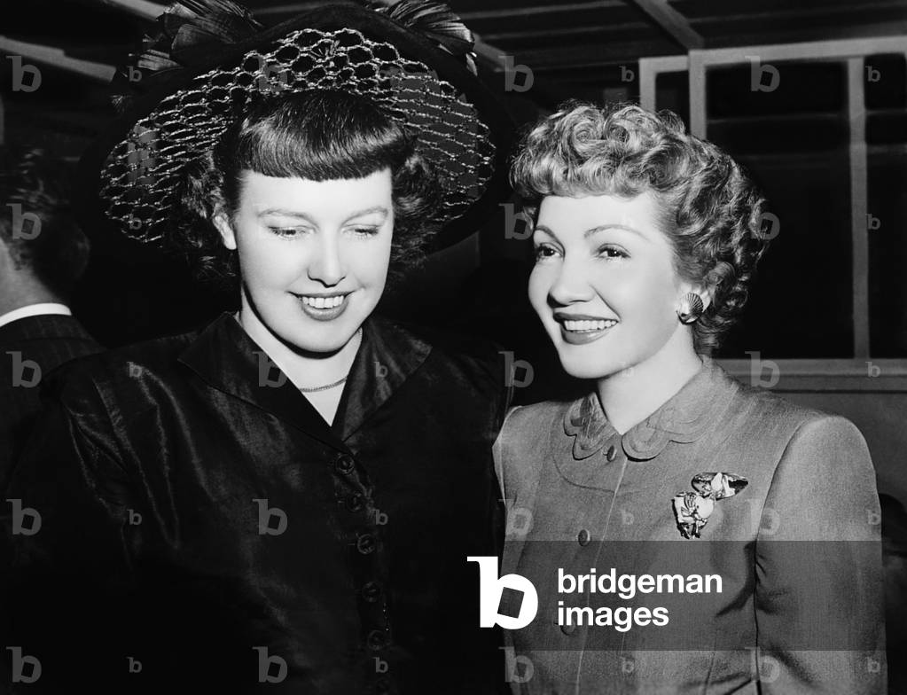 THE EGG AND I, from left: author Betty MacDonald, Claudette Colbert on set, 1947