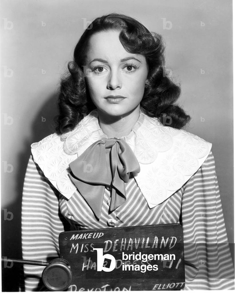 DEVOTION, Olivia de Havilland (wth her name mispelled), having a hairstyle test, 1946