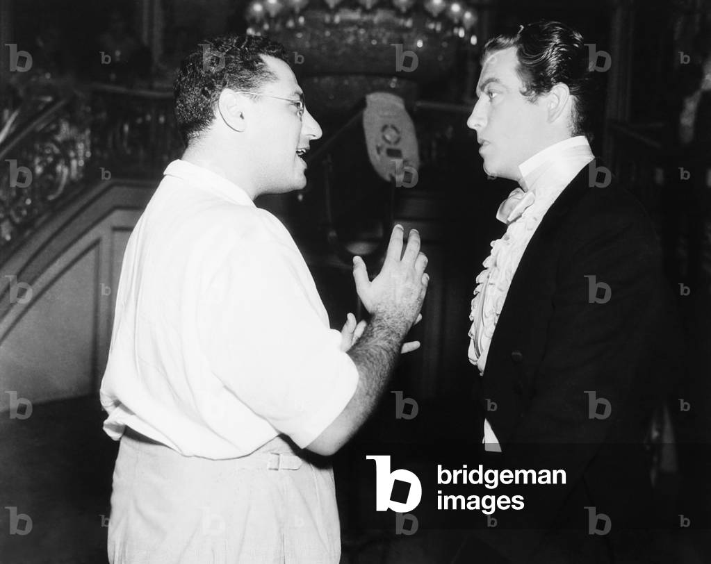 CAMILLE, from left: director George Cukor, Robert Taylor on set, 1936