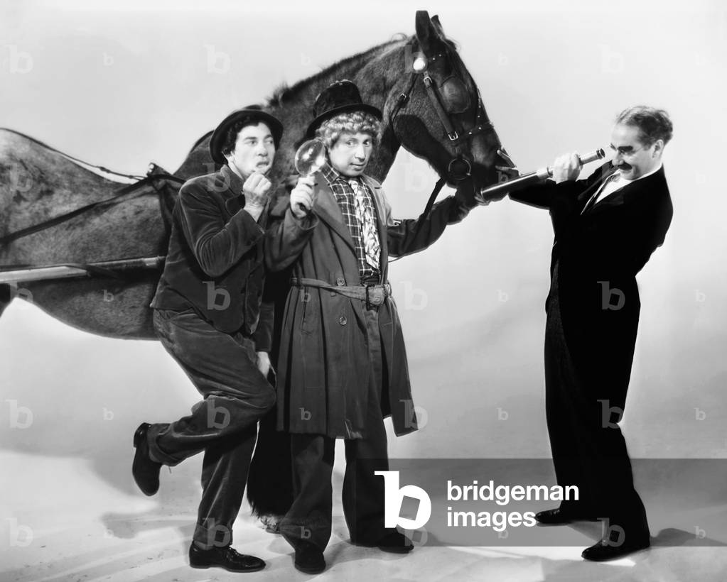 A DAY AT THE RACES, from left: Chico Marx, Harpo Marx, Groucho Marx, 1937
