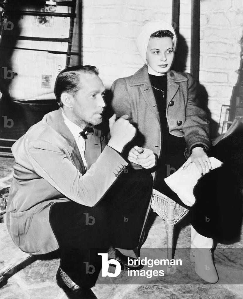 FIVE GRAVES TO CAIRO, from left: Franchot Tone visited by Jean Wallace on set, 1943