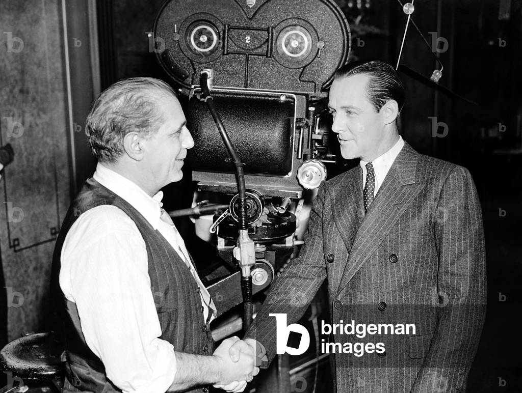 GARDEN OF THE MOON, from left, cinematographer Tony Gaudio, Jimmie Fidler (aka Jimmy Fidler), on-set,  1938