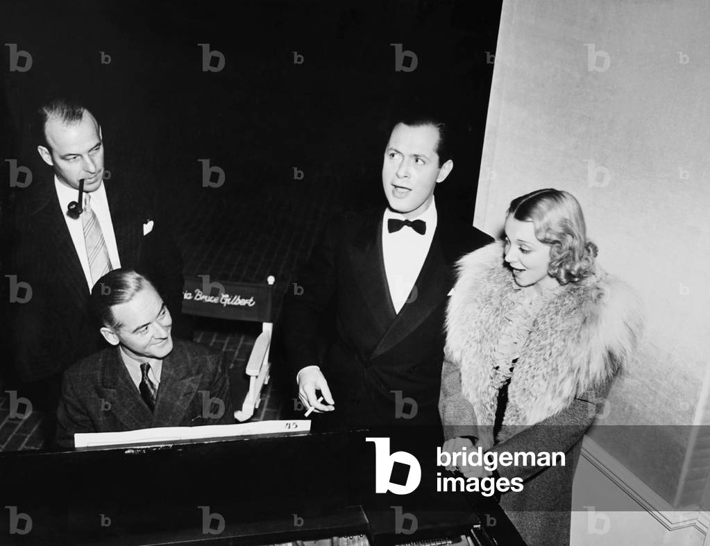 THE FIRST HUNDRE YEARS, from left: director Richard Thorpe, pianist Chris Schoenberg, Robert Montgomery, Virginia Bruce on set, 1938