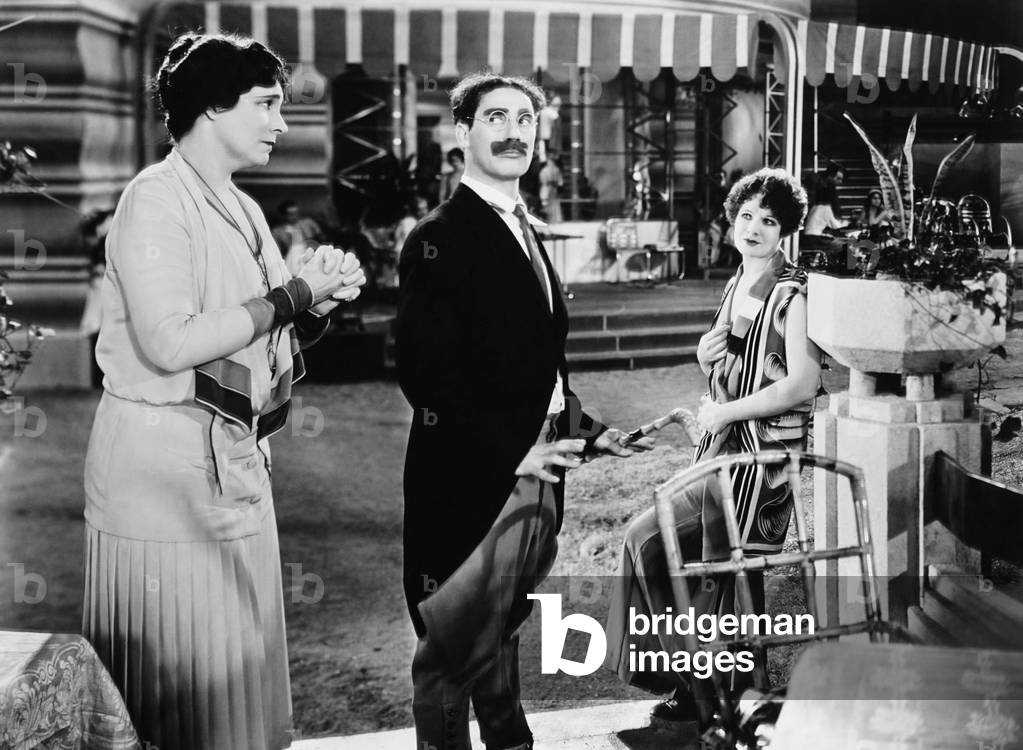 ANIMAL CRACKERS, from left: Margaret Dumont, Groucho Marx, Margaret Irving, 1930