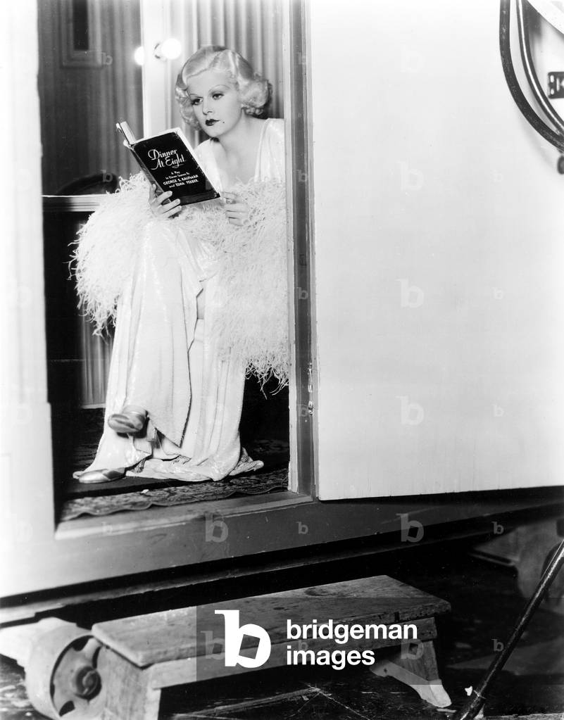 DINNER AT EIGHT, Jean Harlow, reading the Broadway version of the movie script in her dressing room, 1933