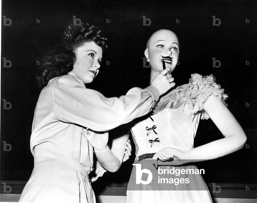 EASY TO LOOK AT, Gloria Jean, decorating a mannequin on-set, 1945