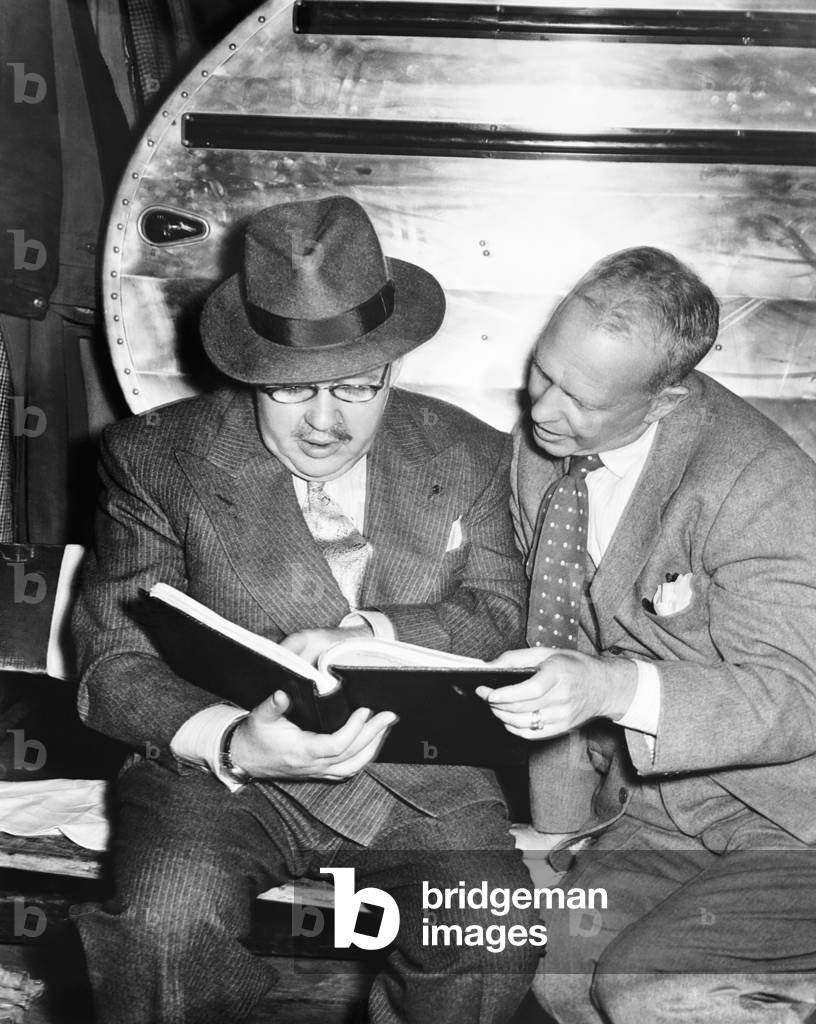 THE BIG CLOCK, from left: Charles Laughton, director John Farrow on set, 1948